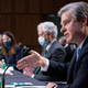 FBI Director Christopher Wray (R) testifies during a Senate Select Committee on Intelligence hearing about worldwide threats, on Capitol Hill in Washington, DC, April 14, 2021.